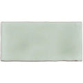 A rectangular matte finished ceramic wall tile in soft mint green with subtle surface texture for half tile use