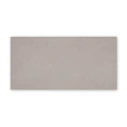 A sleek rectangular gray ceramic Moderna Grey porcelain tile with a subtle matte finish measuring 60 by 30 cm