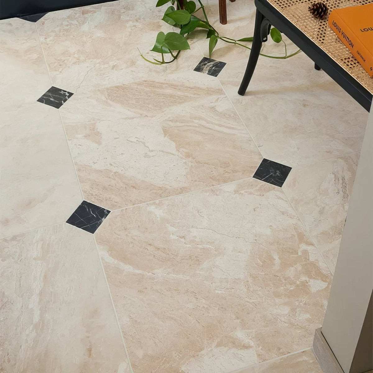 Beige monarch marble honed finish floor tiles with black square accent tiles in a marble effect pattern