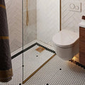 Mono Hex Porcelain Mosaic Blanc white hexagonal porcelain mosaic with a wall-mounted toilet