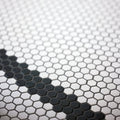 Black and white hexagonal porcelain mosaic tile pattern with a monochrome design for modern interiors