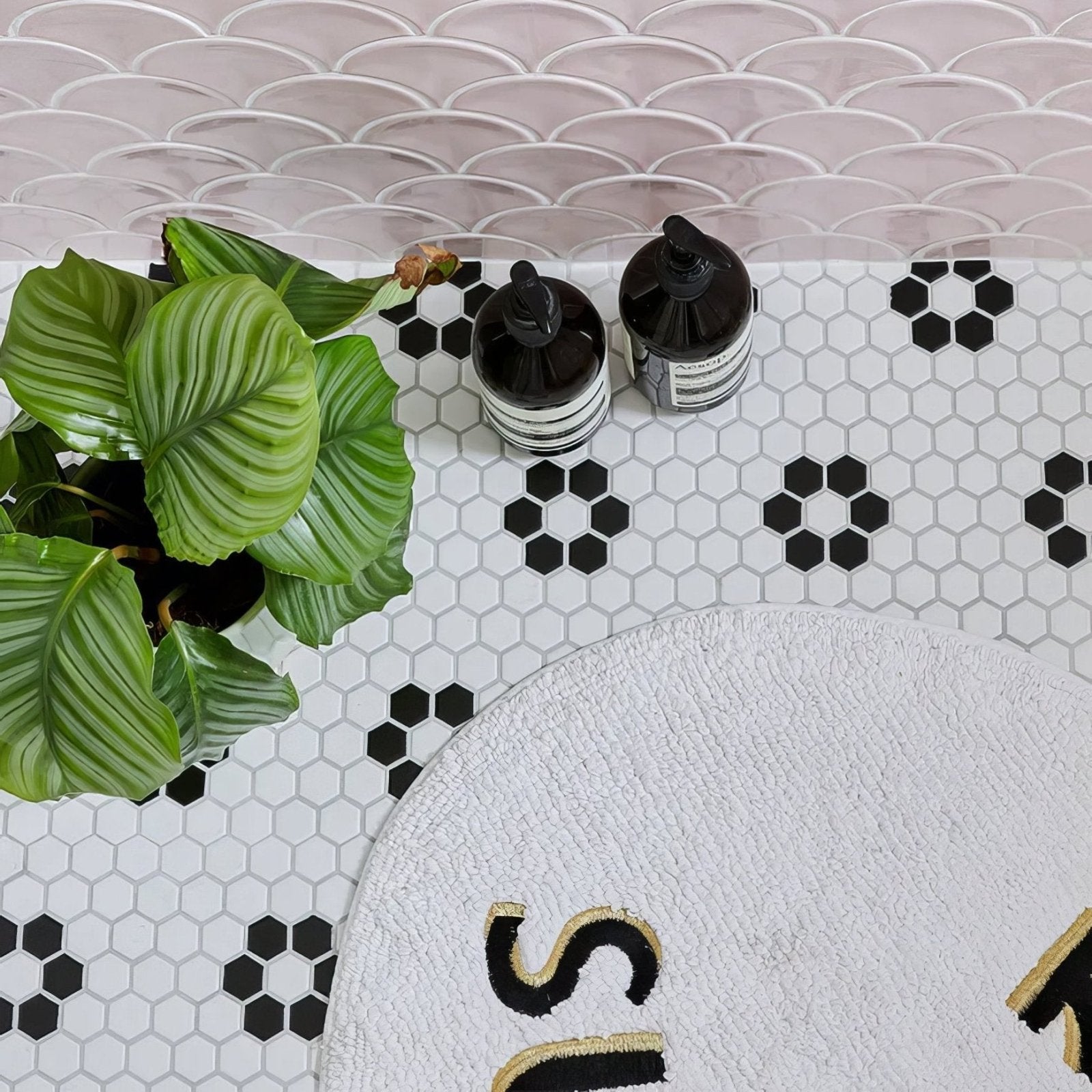 Mono Hex Porcelain Mosaic Daisy white hexagonal porcelain mosaic with a round white bath mat