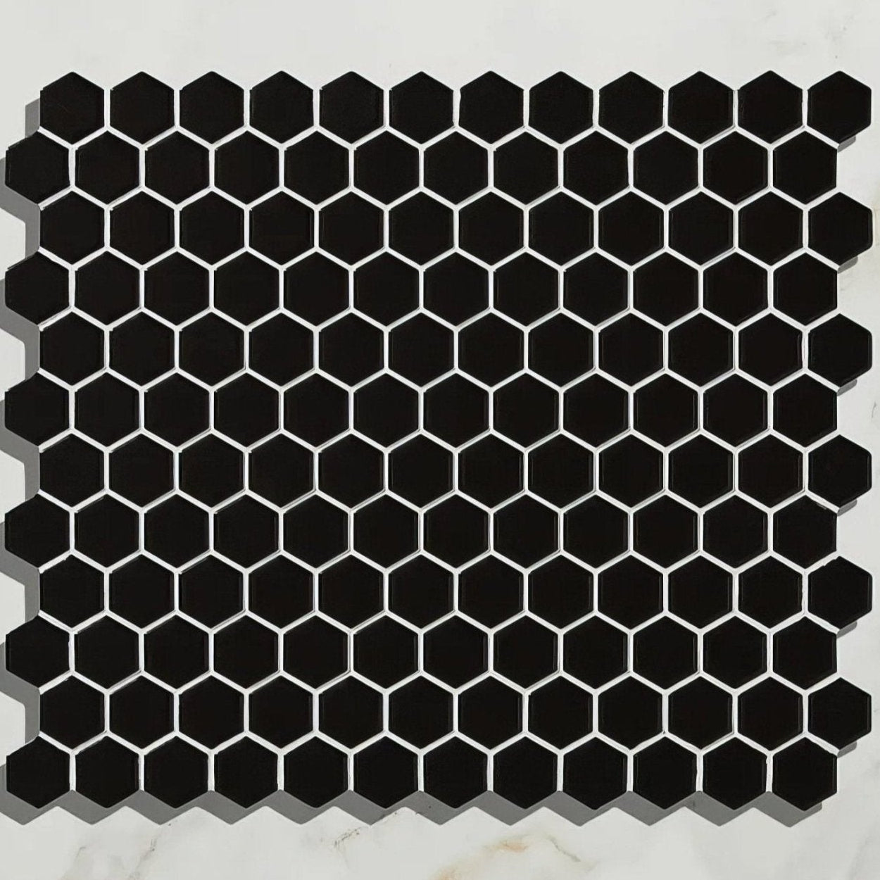 Mono hex porcelain mosaic noir shows black hexagonal tile with white grout lines for modern wall and floor design