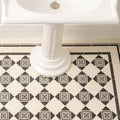 Black and cream diamond patterned ceramic bathroom floor tiles with intricate floral motifs montague black on dover white