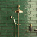 Montblanc emerald brass finished showerhead with matching handheld nozzle and white ceramic handle on green tiles
