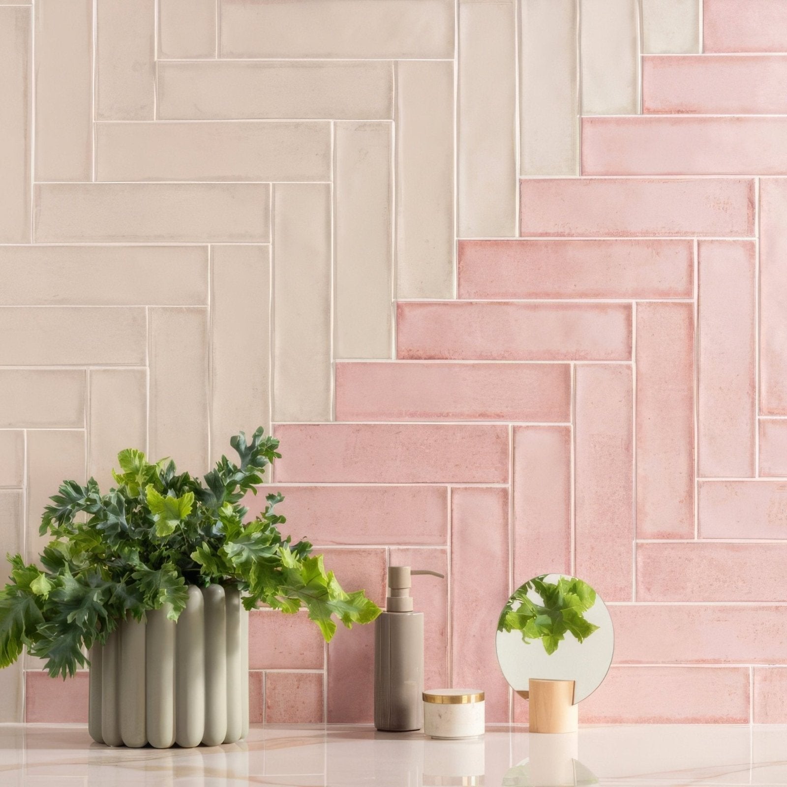 Montblanc pink 30x7.5cm matte gray ceramic vase with vertical ridges holding green foliage against pink white tiles