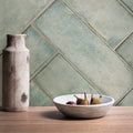 Montblanc Sage ceramic bowl 60 x 20cm off-white textured surface holding ripe figs