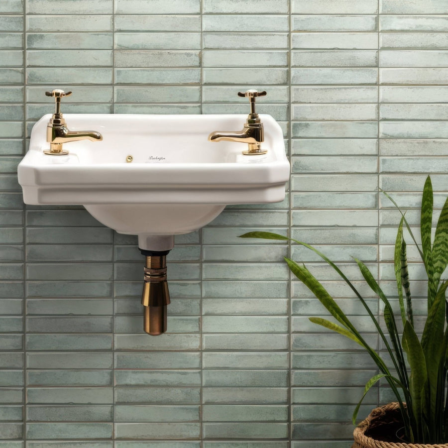White ceramic wall-mounted montblanc sage stack sink with gold cross-handle taps and brass pipe 60 x 20cm