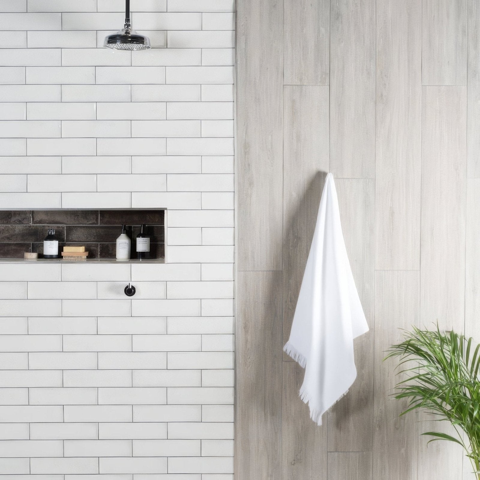 Montblanc white towel 30x7.5cm with soft fringed edges hanging neatly on a wall hook