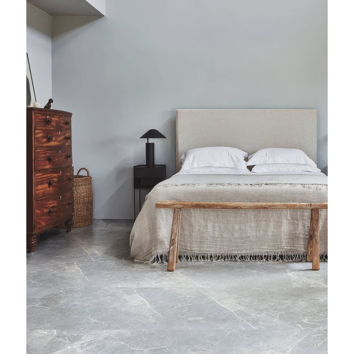 Monza Minerale Pure Matt Click Tile grey marble-effect LVT with an upholstered bed and bench