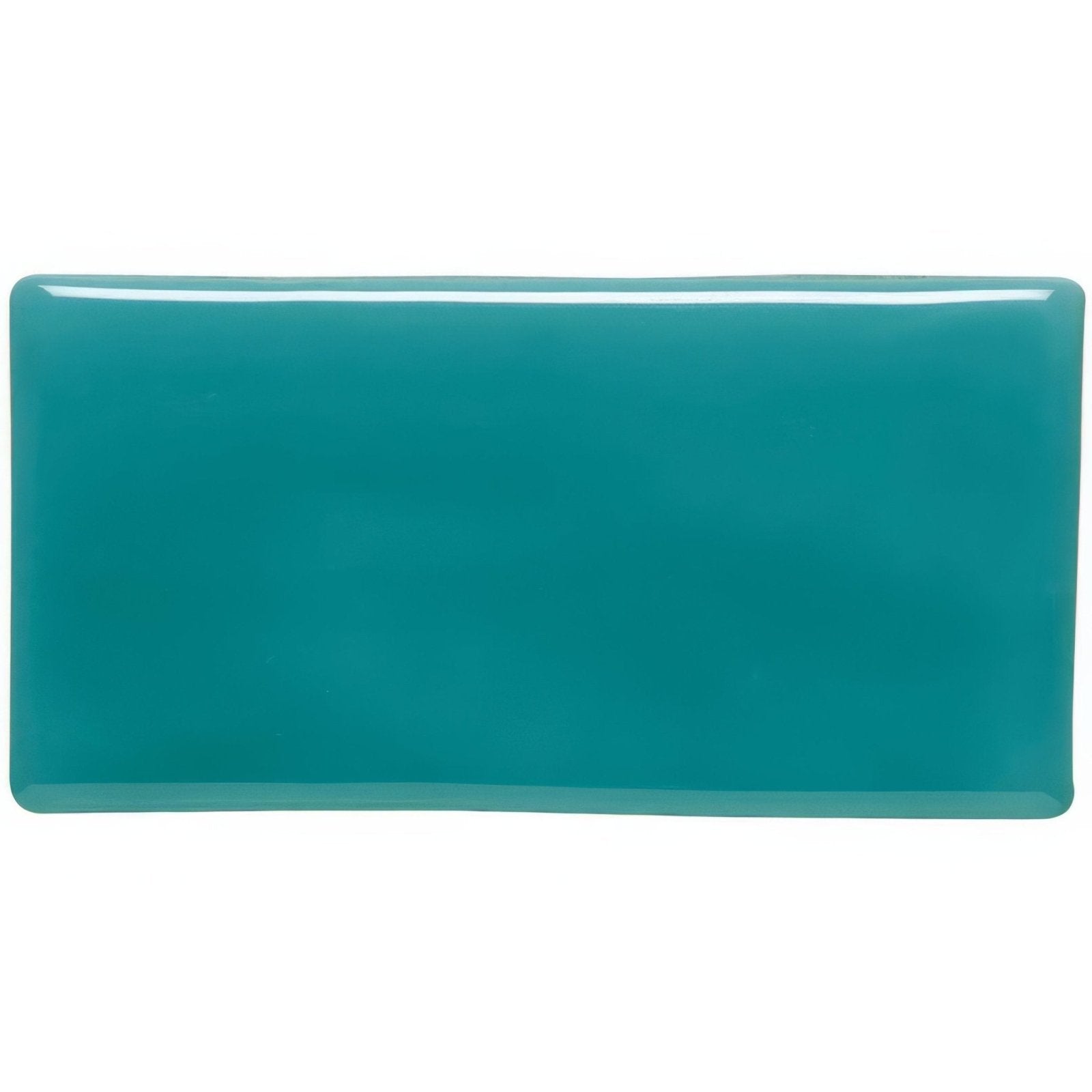 Moonstone half tile in glossy teal with smooth rounded edges and uniform color for wall or backsplash use