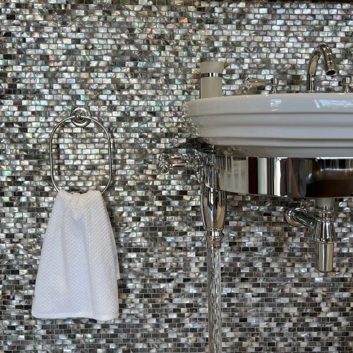 Mother of Pearl Black Rectangle Brick Mosaic iridescent dark shell brick mosaic with a white towel on a chrome ring