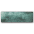 A rectangular ceramic tile with a textured mottled teal and green patina finish nebula green 10 x 30cm