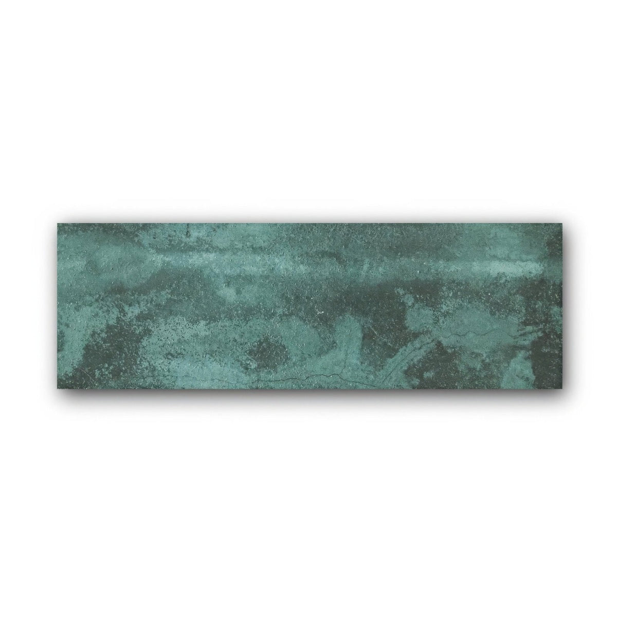 A rectangular ceramic tile with a textured mottled green patina finish called nebula green 10 x 30cm
