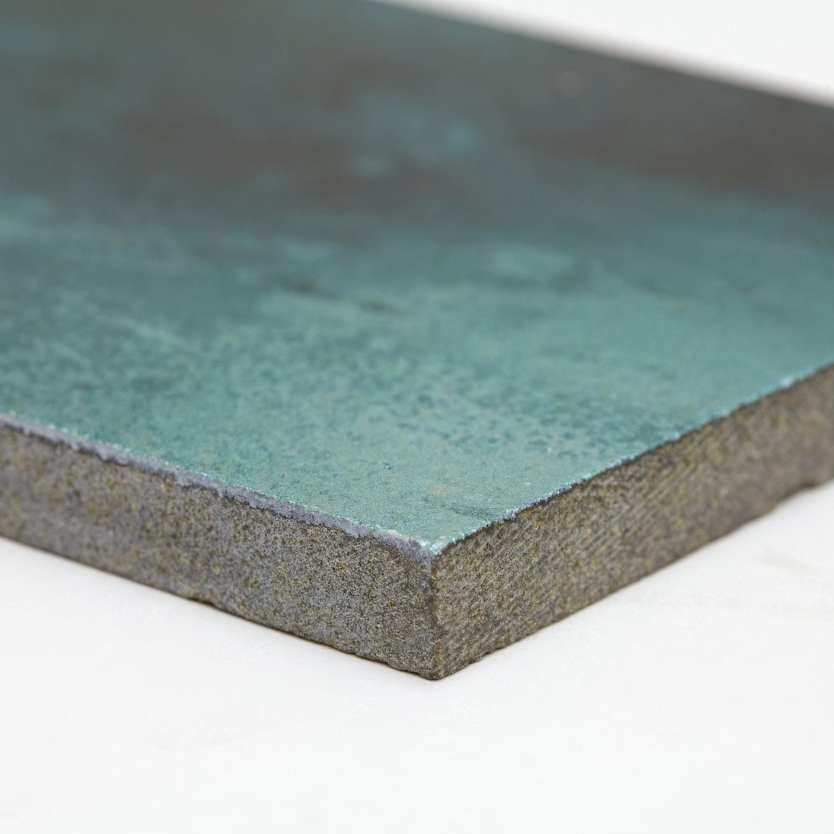 Nebula green 10 x 30cm teal green textured ceramic tile with rough stone like edge for wall or floor use