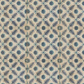 Vintage-style ceramic tiles featuring a repeating dark blue and teal leafy pattern on an off-white background by neisha crosland