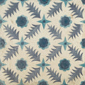 Antique ceramic tile featuring a repeating dark blue and teal floral pattern on an off-white background by neisha crosland