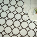 White and black circular patterned floor tiles from neisha crosland tulia hula hoop black collection