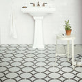 White pedestal sink with chrome faucets featured in neisha crosland tulia hula hoop black product design