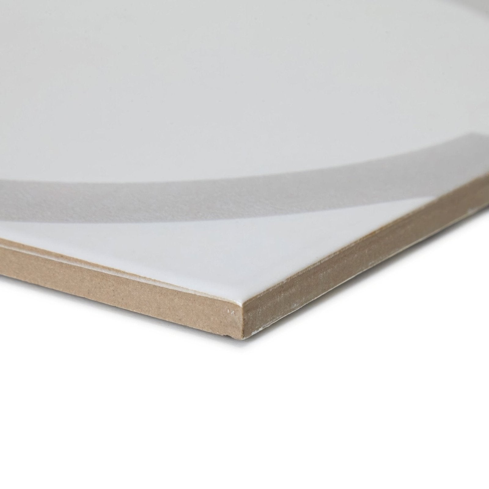 White glossy ceramic tile with beige cardboard backing shown from the back in neisha crosland tulia hula hoop dove design