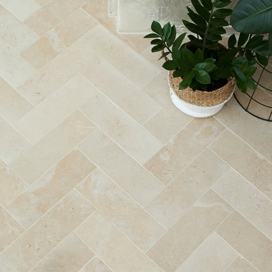 Beige herringbone patterned buscot limestone brick velvet finish stone floor tiles in natural stone material