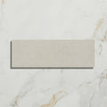 Beige rectangular buscot limestone brick tile with subtle textured surface and velvet finish