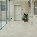 Beige herringbone patterned buscot limestone brick floor tiles with a velvet finish