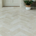 Beige herringbone patterned buscot limestone brick velvet finish stone floor tiles with a smooth texture