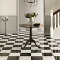 Nero Polished Marble black marble tiles with a round table and vase of roses