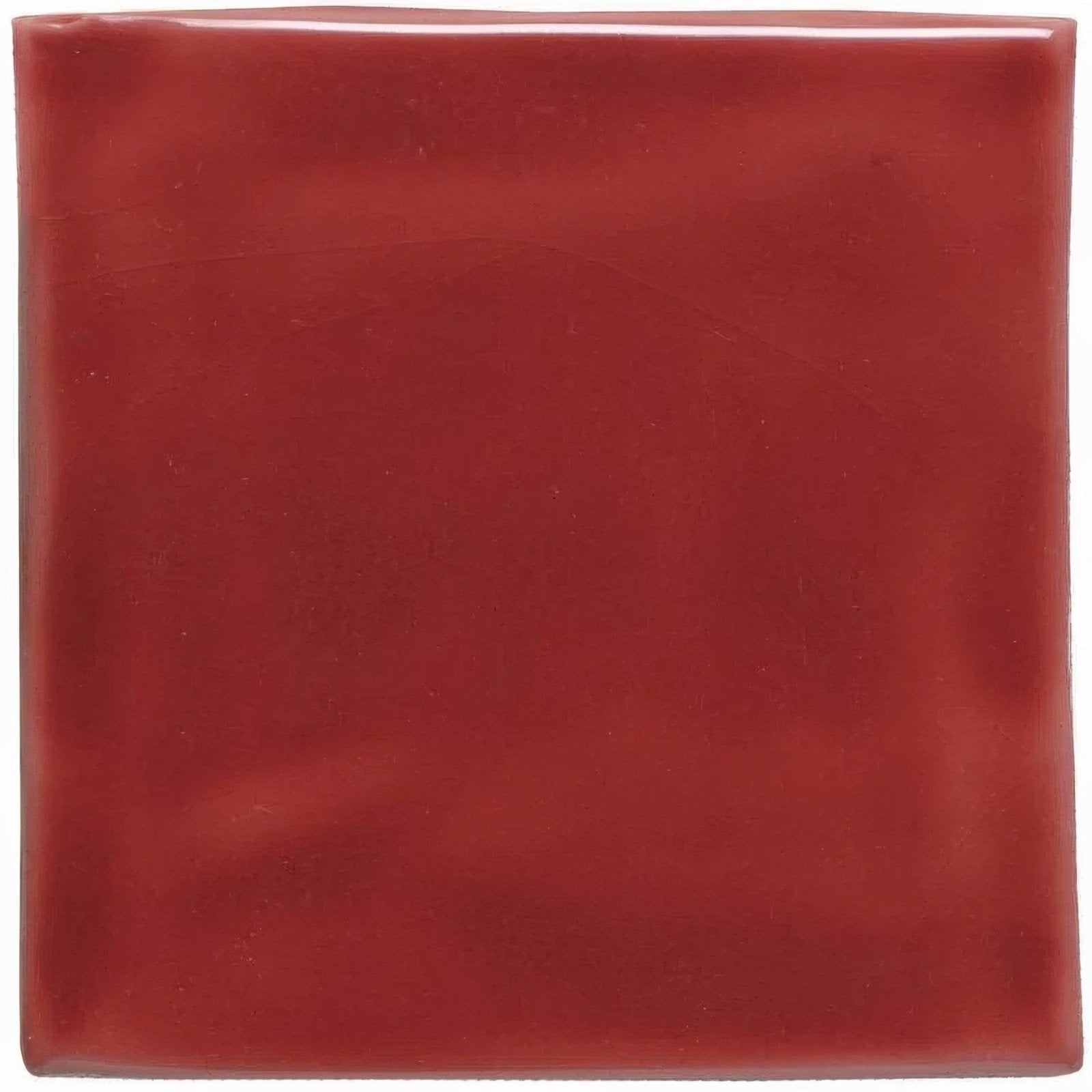 A square glossy red ceramic tile with a smooth reflective surface from the new burgundy field tile collection