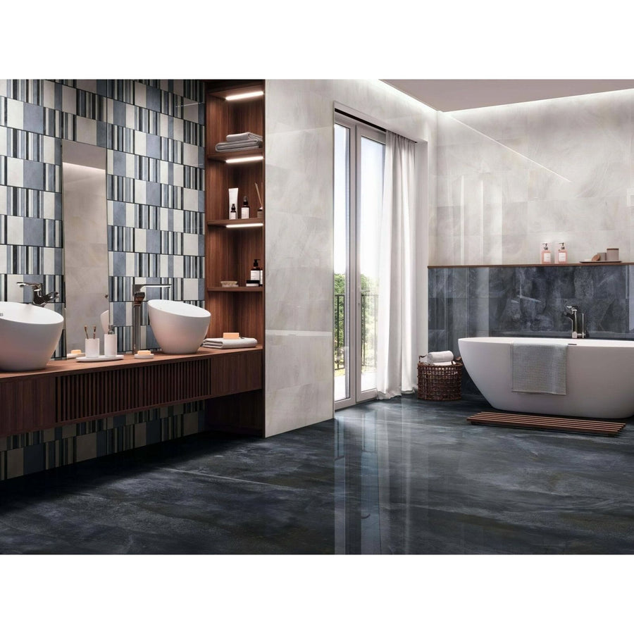 Nilo 1846 Blue Polished dark grey marble-effect tiles with a freestanding bathtub