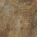 Earth-toned ceramic tile with a mottled stone-like finish in caramel polished finish nilo 1846
