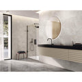 Nilo 1846 Moon Polished grey concrete-effect tiles with an oval mirror