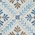 White ceramic nina campbell goa indigo chocolate porcelain tile with hand-painted blue and brown leafy diagonal pattern