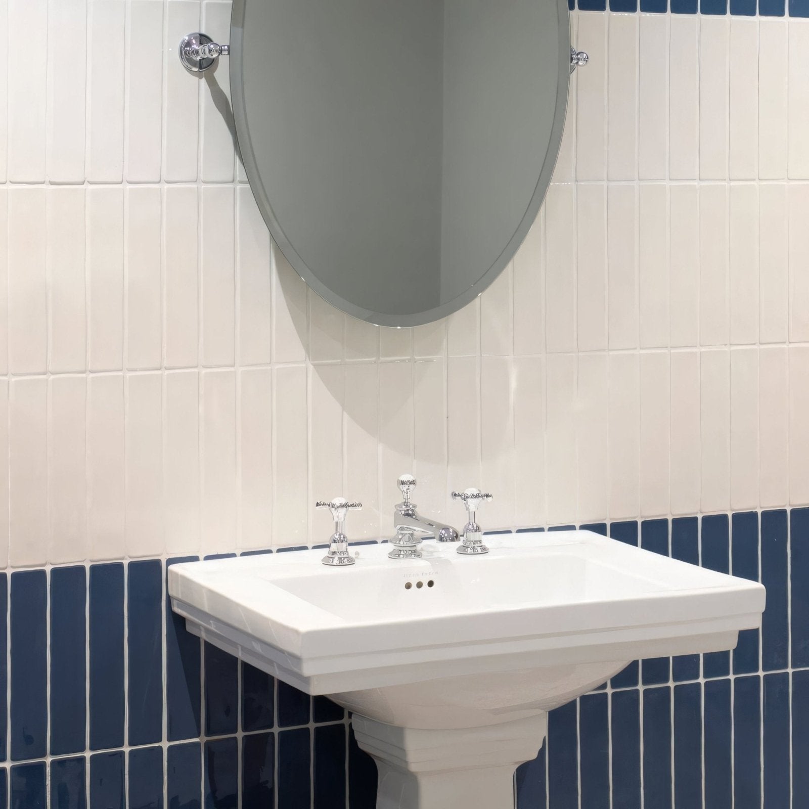 Nina Campbell Rivage Indigo Glazed Wall Tile indigo glazed ceramic tiles with a pedestal sink