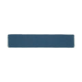 A sleek navy blue ceramic Nina Campbell Rivage Indigo glazed wall tile with smooth glossy edges and rectangular shape