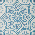 A square ceramic nina campbell ronda blue porcelain tile with a white base and intricate blue geometric floral patterns