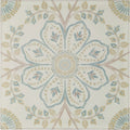 A square ceramic nina campbell topkapi aqua porcelain tile with an intricate symmetrical floral design in muted teal and beige