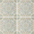 Set of four Nina Campbell Topkapi Aqua porcelain tiles with intricate floral mandala design in soft blue beige and muted green