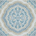 A square ceramic nina campbell udaipur blue porcelain tile with an intricate symmetrical mandala design in blue beige and white