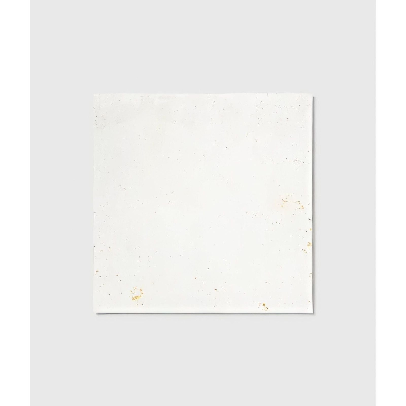 White ceramic tile from Nuance Ceramic with subtle gold speckles ideal for elegant wall or floor designs