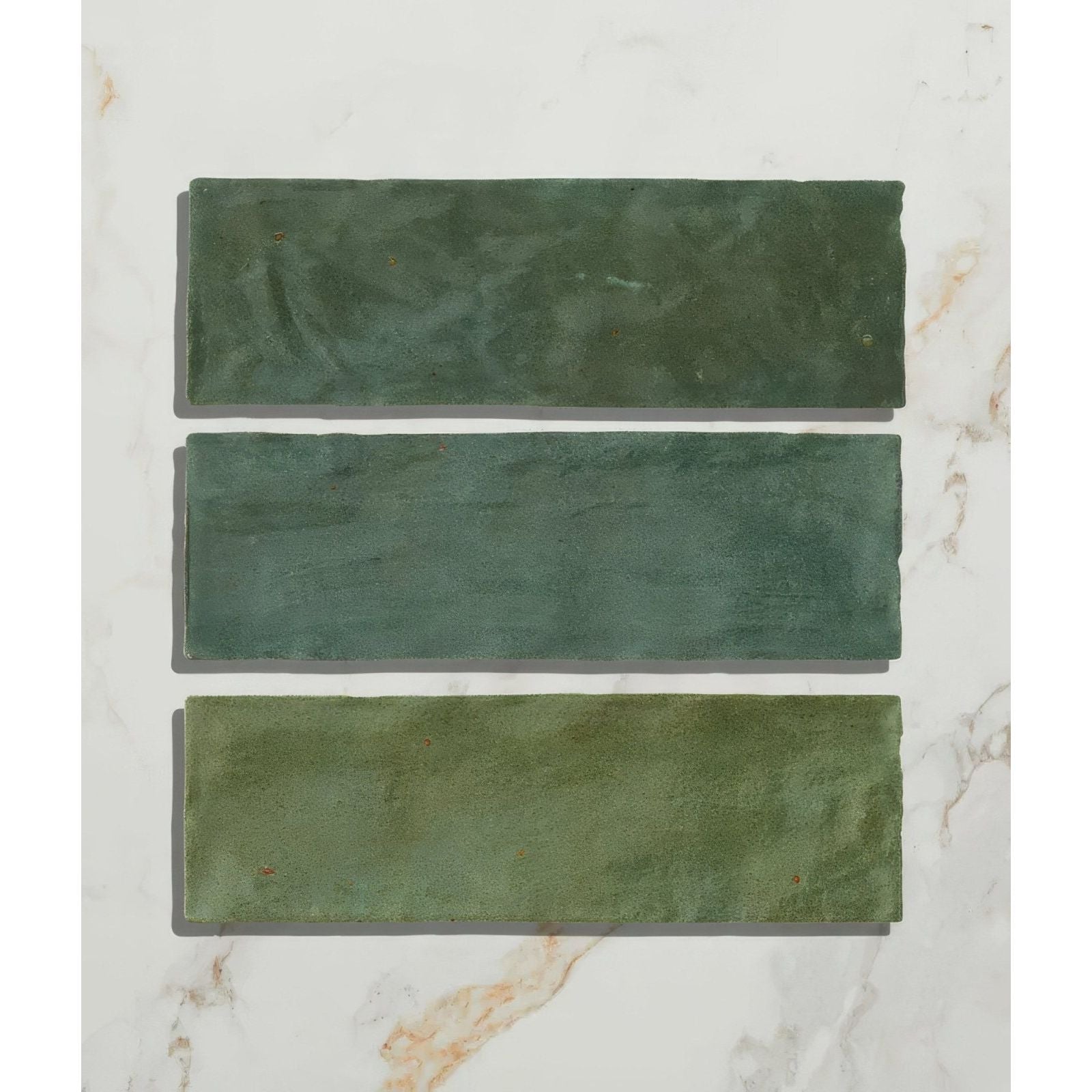 Three rectangular matte finish oasis ceramic green gloss tiles in varying shades of green with subtle texture displayed vertically