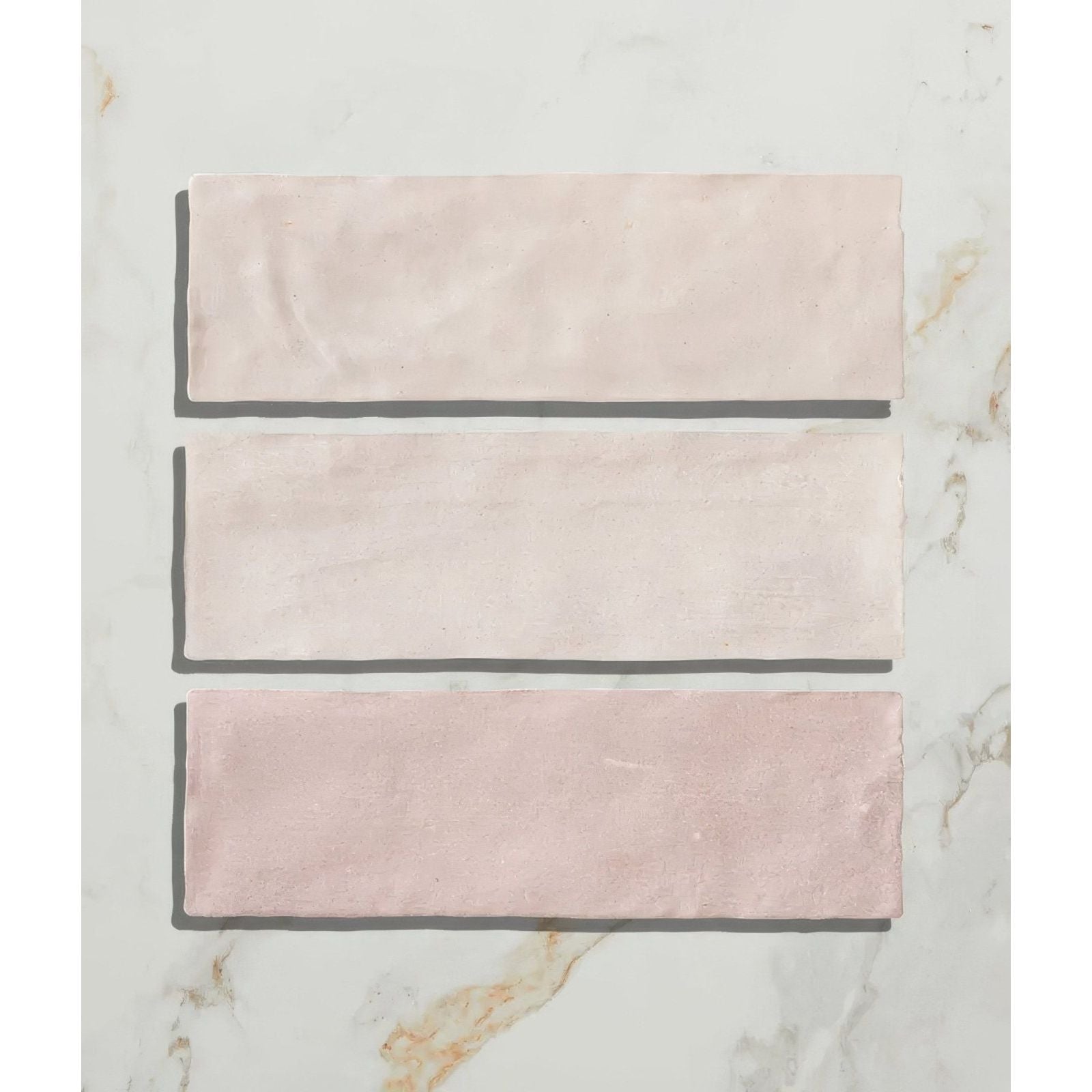 Three rectangular blush pink ceramic tiles with matte slightly textured finish from oasis ceramic pink gloss collection