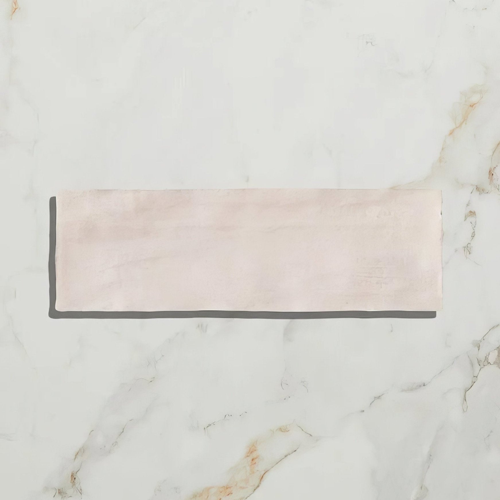 A rectangular pale pink ceramic sheet with a subtle textured surface from oasis ceramic pink gloss collection