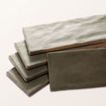 Stacked rectangular oasis veloute ceramic sage matt tiles with textured matte finish in varying gray shades