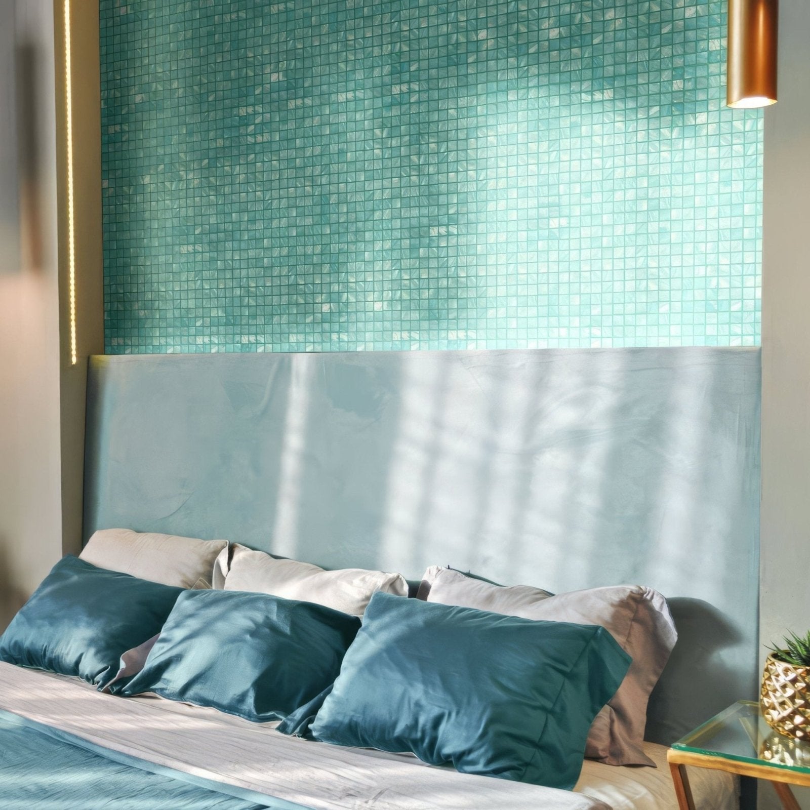 The oceans calm 25mm square bed features a plush teal velvet headboard with matching satin pillows and bedding