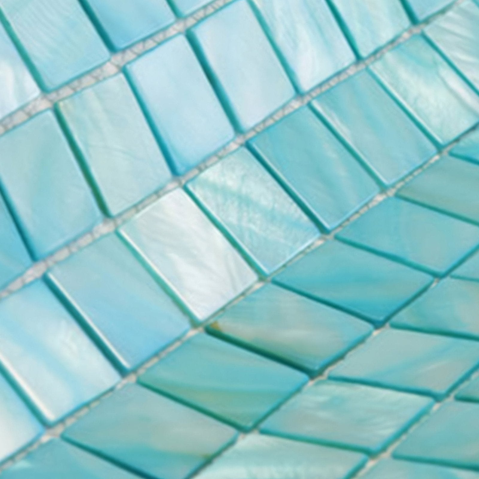 Ocean’s calm 25mm square shimmering turquoise mosaic tiles with a glossy iridescent finish for decorative use