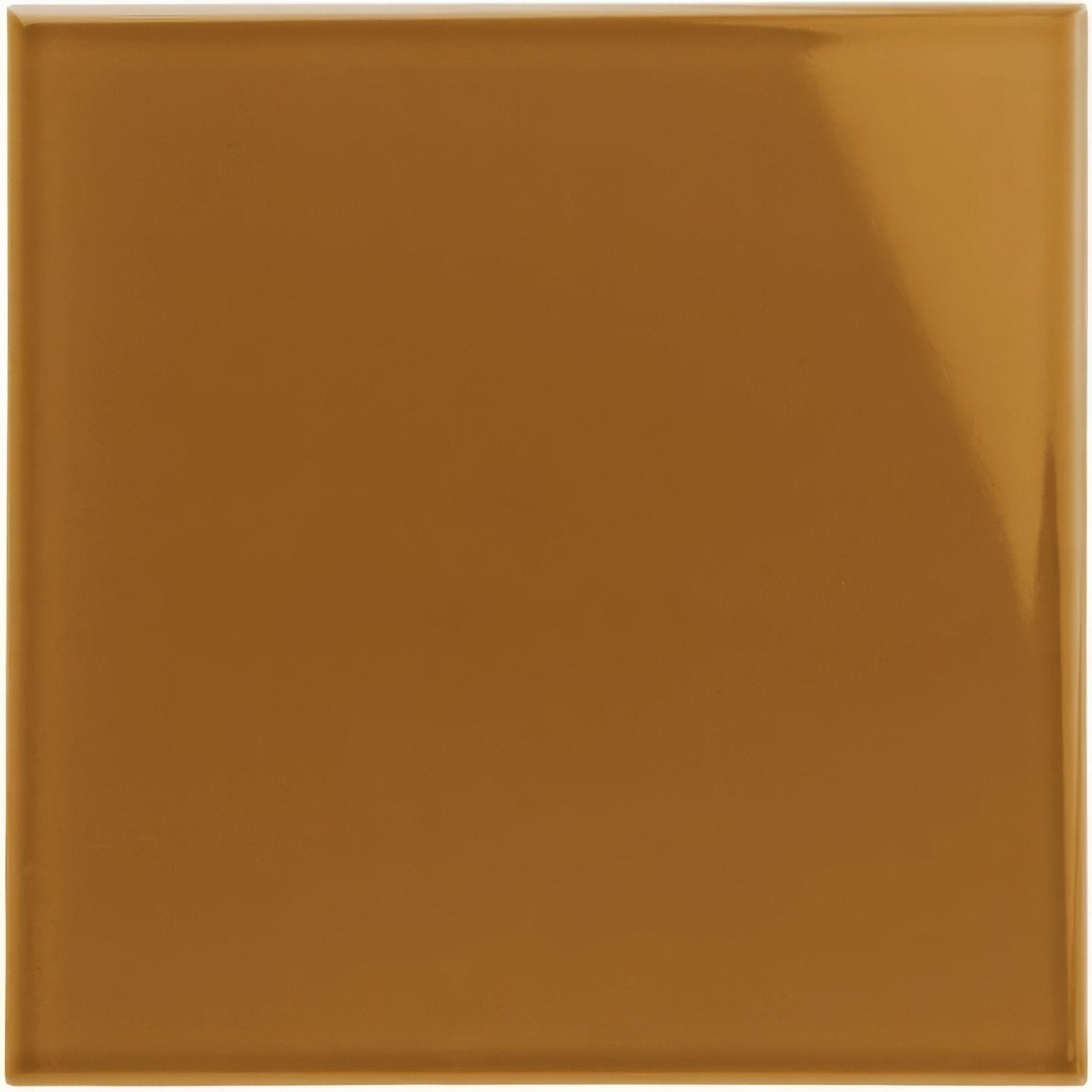 A glossy caramel-colored ochre field tile with a smooth reflective surface for wall and floor use