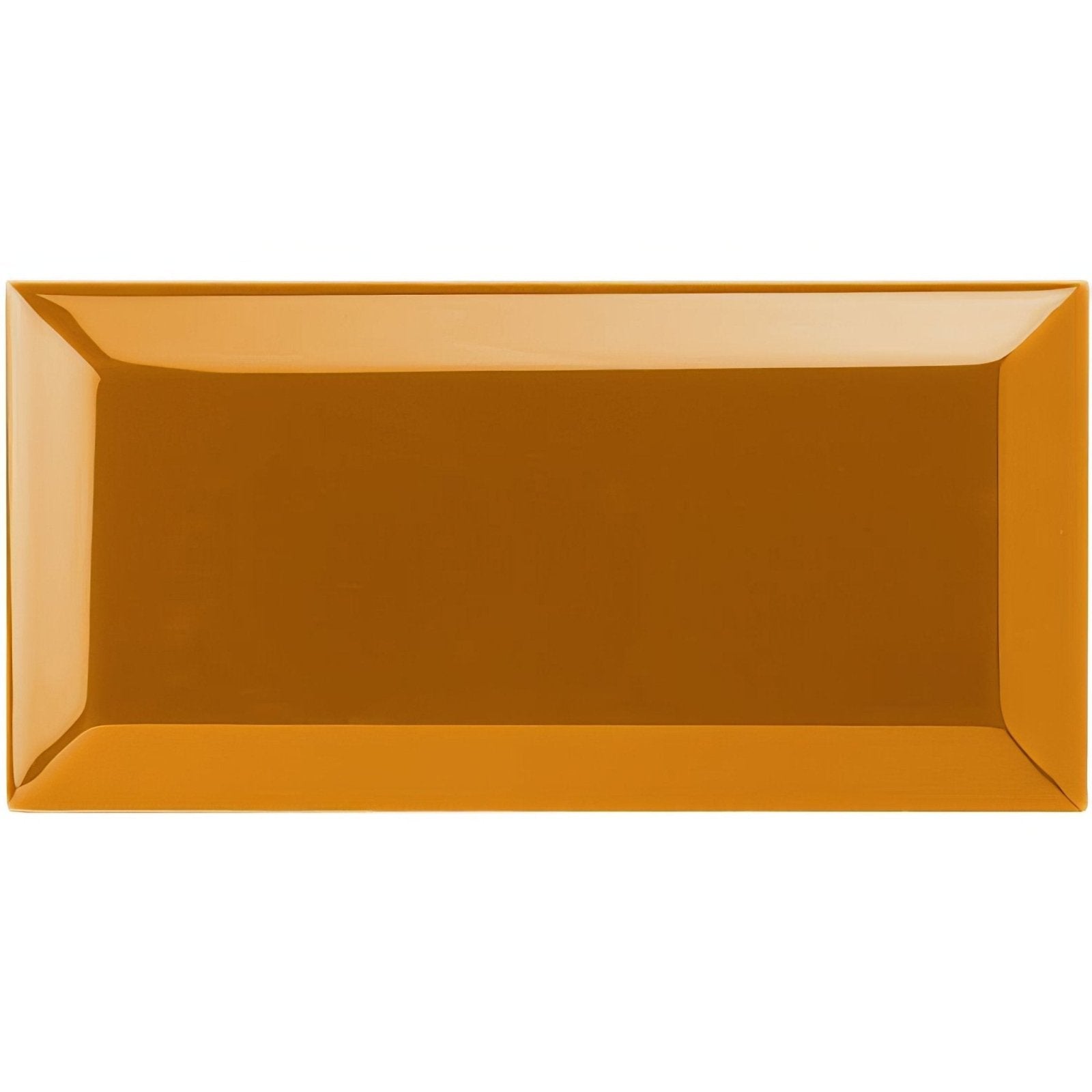 A glossy amber ochre metro bevelled tile serving platter with a smooth reflective surface and slightly raised edges