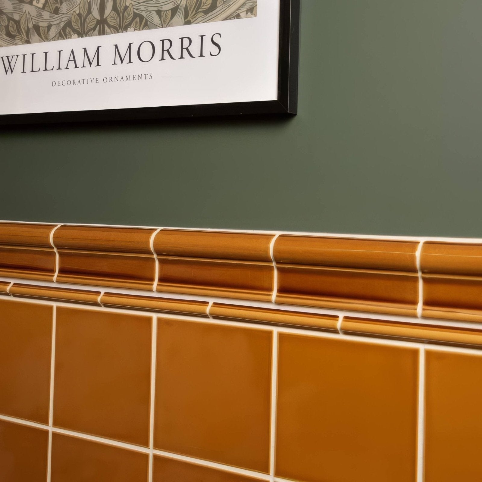 Warm amber ochre victoria moulding ceramic tiles with a glossy finish in a classic grid pattern and white grout lines
